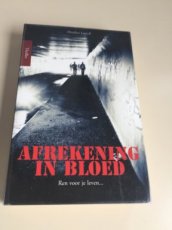 Boek / Heather Lowell - Afrekening in bloed.